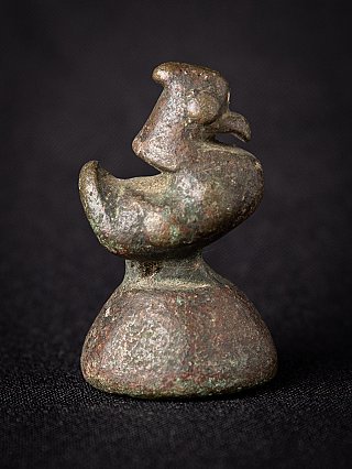 Bronze opium weight from Myanmar, bird form with curled tail, side view