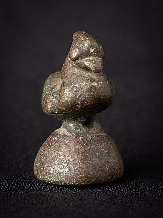 Bronze opium weight from Burma, bird-shaped three-quarter view with patina