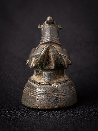 Antique bronze opium weight from Myanmar, rear view showing tail and stepped base