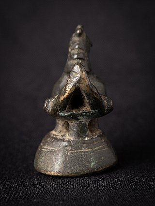 Burmese bronze opium weight, front view showing the triangular opening in the chest