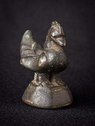 Bronze opium weight from Myanmar, three-quarter view highlighting the bird head and rounded body