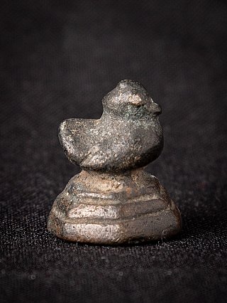 Bronze opium weight from Burma (Myanmar), 18th century, side view showing rounded head and broad top