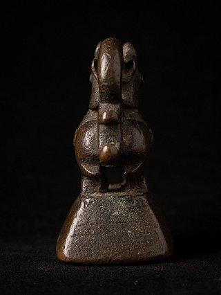 Antique bronze opium weight from Myanmar, 18th century, rear view showing looped tail and base