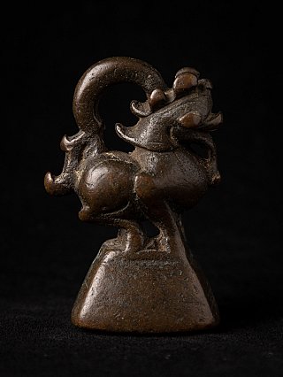 Bronze opium weight from Burma, 18th century, animal-form in side view with curled tail