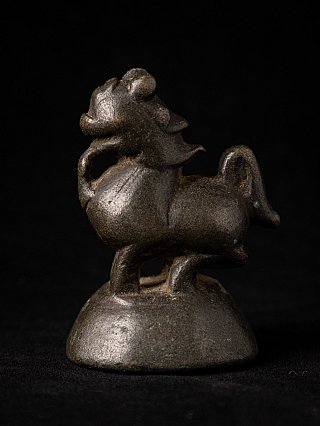 Bronze opium weight from Burma (Myanmar), animal-shaped form on rounded base in side view