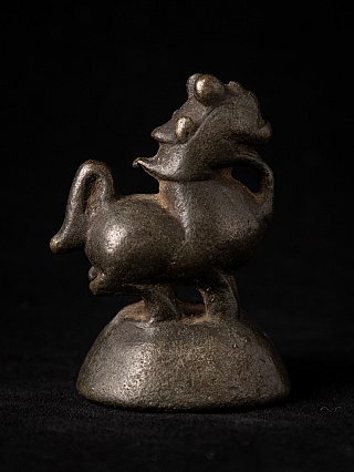 Bronze opium weight from Burma (Myanmar), animal figure on rounded base in opposite side view