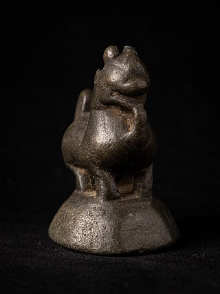 Antique bronze opium weight from Burma (Myanmar), three-quarter view highlighting head and chest
