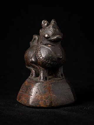 Bronze opium weight from Myanmar G-171 showing animal head and chest, angled view