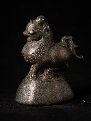Bronze opium weight from Burma (Myanmar), animal figure on base, three-quarter left view