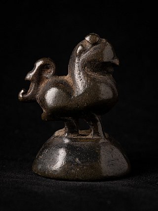 Bronze opium weight from Burma (Myanmar), side view with curled tail