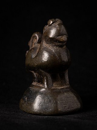 Bronze opium weight, three-quarter view highlighting head and chest