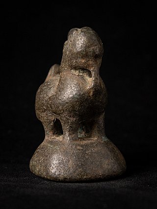 Burmese bronze opium weight, 18th century, rear three-quarter view on the domed base