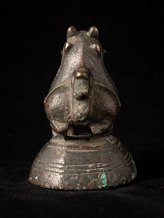 Antique bronze opium weight, rear view showing tail and stepped base