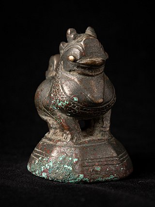 Bronze opium weight, three-quarter view with head and collar detail