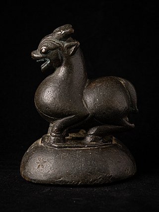 Burmese bronze opium weight, animal figure on oval base in left side view