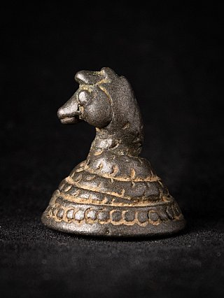 Bronze opium weight from Burma (Myanmar), side view with animal head and stepped base