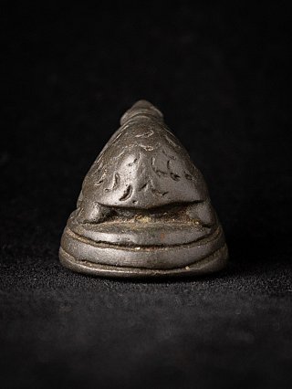 Antique Burmese bronze opium weight, rear view showing incised back on round base