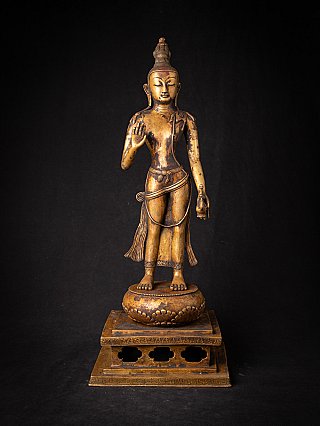 Lokeshwor statue in Nepali bronze, standing with raised right hand in abhaya mudra, full front