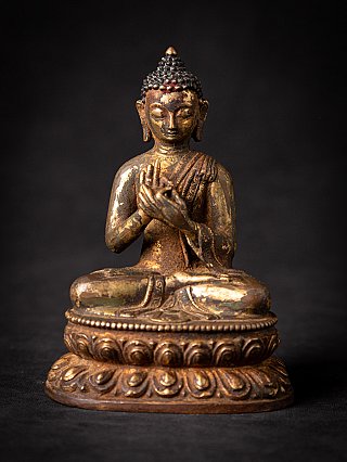 Bronze Nepali Buddha statue seated on a lotus base, dharmachakra mudra, full front view