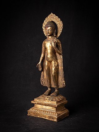 Bronze Nepal Buddha statue, three-quarter left view with halo and stepped base