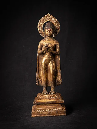 Nepali bronze Buddha statue, late 19th century, standing on stepped base, full-front view