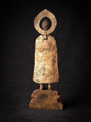 Bronze Buddha statue from Nepal, rear view with back of robe and halo attachment