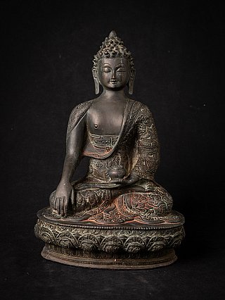 Buddha statue in bronze from India, seated on a round base with right hand down