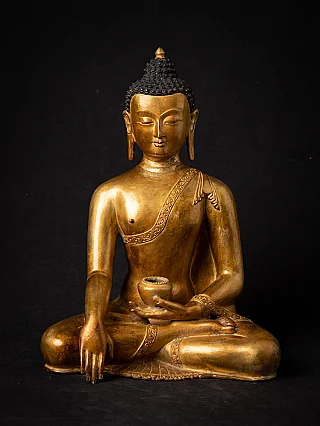 Nepali bronze Buddha statue seated, full-front view with bhumisparsha mudra and alms bowl