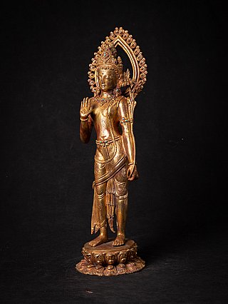 Lokeshwor bronze statue from Nepal with crown and halo, three-quarter left view