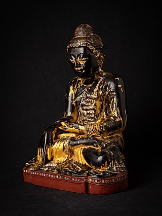 Wooden Burmese Buddha statue with black lacquer and gilding, three-quarter right view
