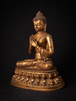Bronze Nepal Buddha statue with dharmachakra mudra, three-quarter left view