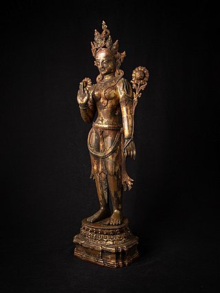 Green Tara statue from Nepal in bronze, three-quarter left view with crown and lotus stems