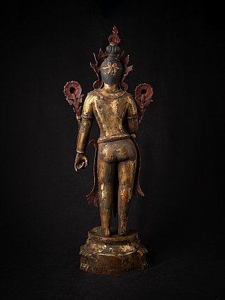 Green Tara statue in bronze from Nepal, rear view with hair arrangement and lotus motifs behind the shoulders