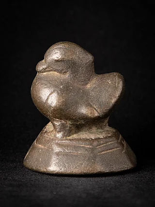 Antique bronze opium weight from Burma (Myanmar), bird-shaped form on stepped base, three-quarter view