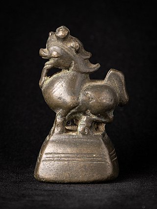 Bronze opium weight from Burma (Myanmar), animal figure on pedestal in side view