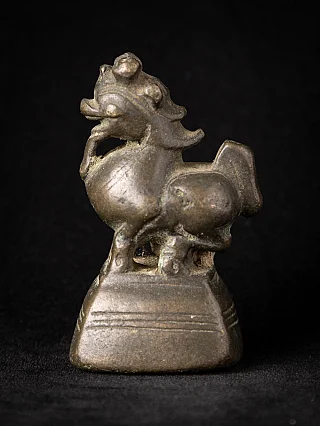 Bronze opium weight from Burma (Myanmar), animal figure on pedestal in side view