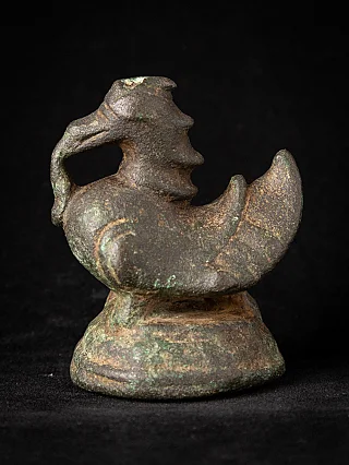 Antique bronze opium weight from Burma (Myanmar), 19th century, three-quarter view on round base