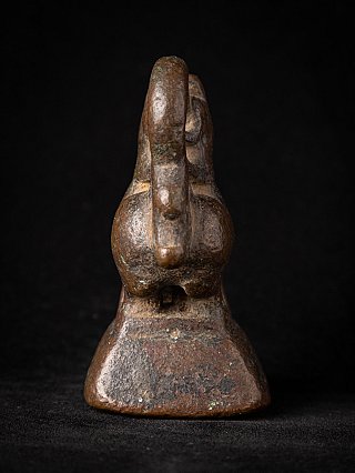 Bronze opium weight from Burma (Myanmar), 19th century, rear view with curved tail