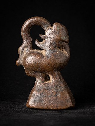 Antique bronze opium weight from Burma (Myanmar), 19th century, side profile with curled tail