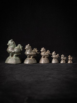Set of 6 bronze opium weights from Burma, animal figures lined up in side view