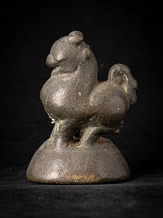 Bronze opium weight from Burma (Myanmar), three-quarter view of the animal on a rounded base