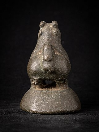 Antique bronze opium weight, rear view showing the tail and opening between the legs