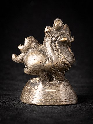 Bronze opium weight from Burma (Myanmar), side profile with curled tail and rounded base