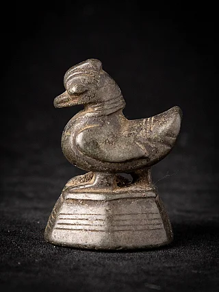 Bronze opium weight from Burma (Myanmar), bird-shaped form on stepped base, side view