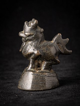 Burmese bronze opium weight, 19th century, three-quarter view from the left