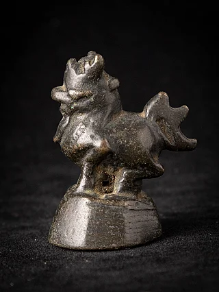 Burmese bronze opium weight, 19th century, three-quarter view from the left