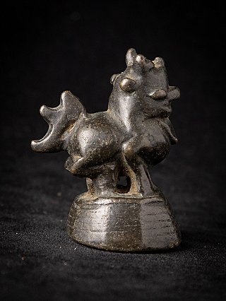 Antique bronze opium weight from Burma (Myanmar), side view showing the tail