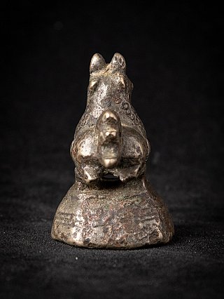Antique Burmese bronze opium weight, rear view showing the tail and base