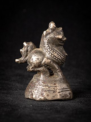 Antique Burmese bronze opium weight with animal figure, right side profile