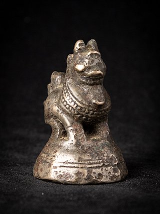Burmese bronze opium weight with animal figure on base, three-quarter right view